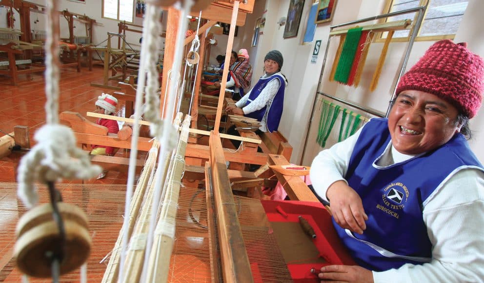 Women from Community Working at Loom