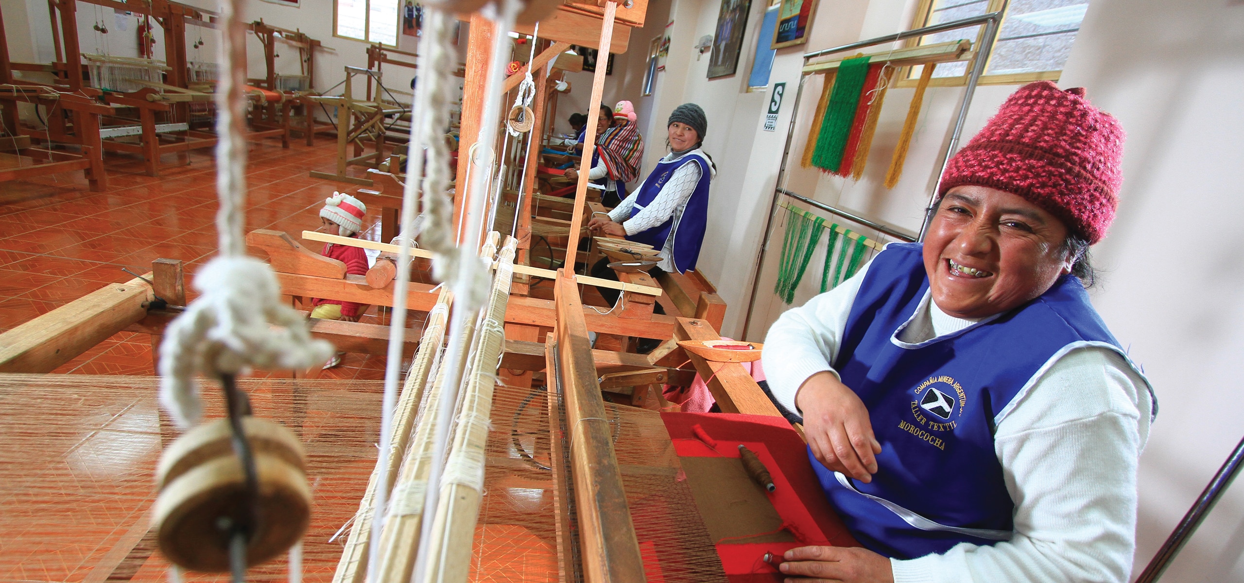 Women from Community Working at Loom