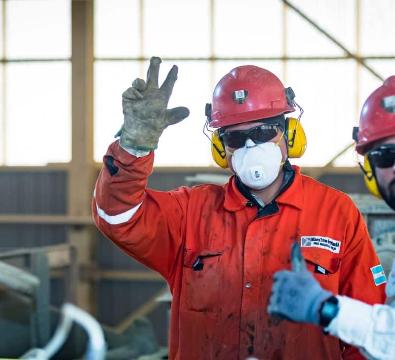 Two Pan American Silver Employees Waving at the Camera