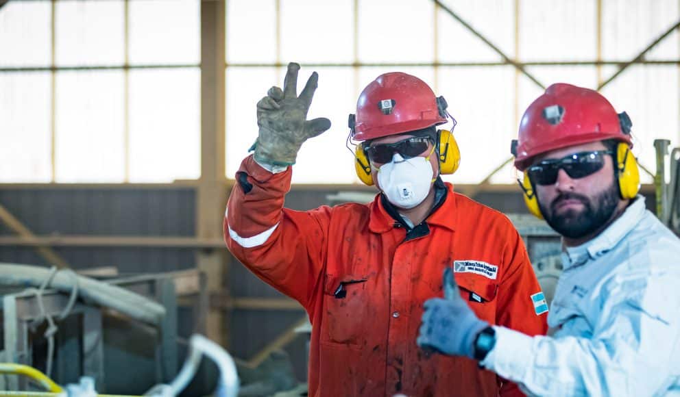 Two Pan American Silver Employees Waving at the Camera