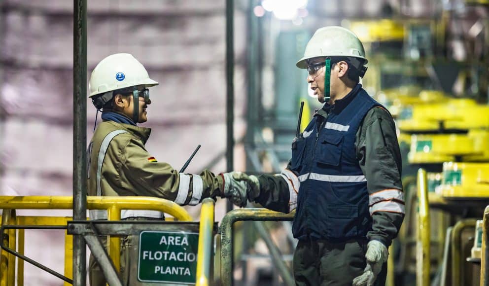 Two Pan American Silver Employees Talking and Shaking Hands