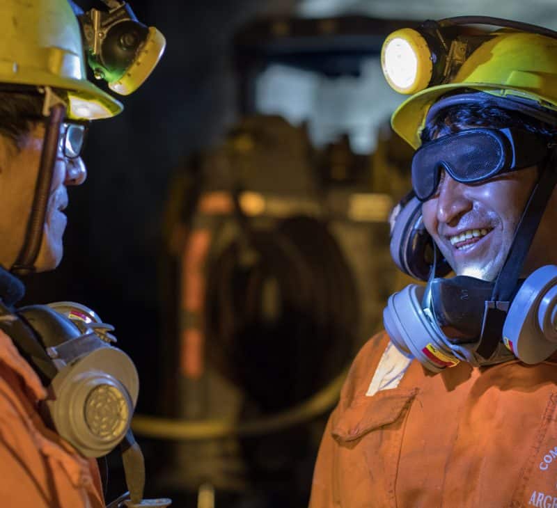 Two Pan American Silver Mine Employees Having a Conversation